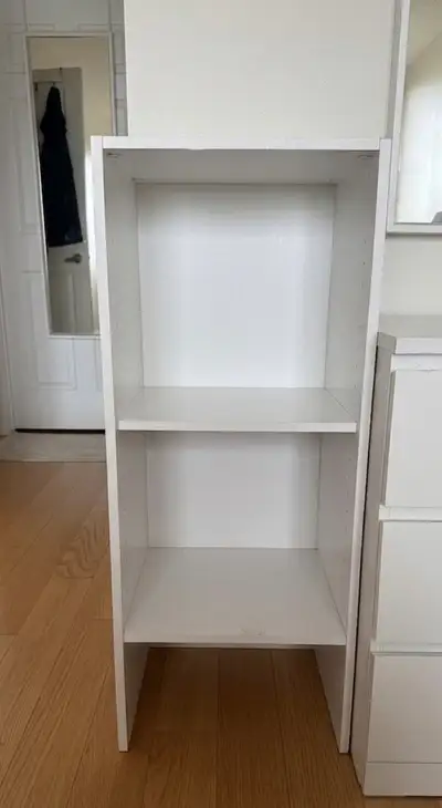 These two minimalist white storage shelves are the perfect organizational solution for any bedroom,...