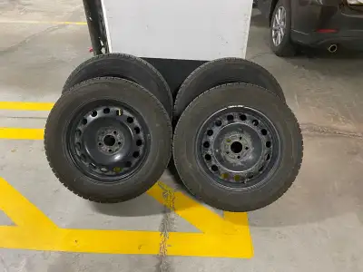 Selling a set of Michelin X-Ice Snow winter tires mounted on black steel rims. Tires are in very goo...
