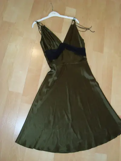 Ladies silk dress $65 medium by Miguelina dark olive colour with black sheer draped at waistline 95%...