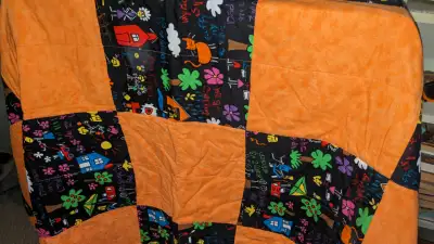 Decorative hand-made child's quilt: 38.5" by 58"., View more