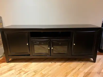 I'm selling a stylish black TV stand that offers both functionality and a touch of elegance to your...
