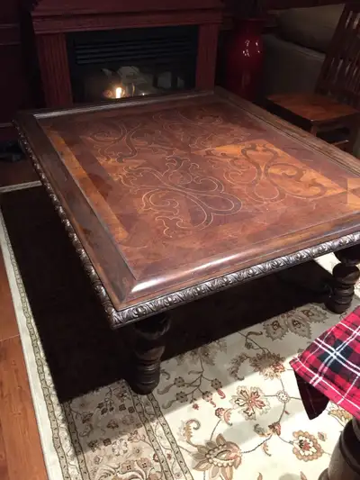 Wood cocktail table 56”x44”. Slightly higher than regular coffee table at 22” Inlaid wood pattern an...