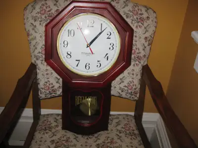 21 x 121/2 inches. Quartz timing mechanism just relaced. Keeps excellent rime. Pendulum does not swi...