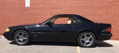 122,200 original KM With wind deflector and hard top holder. Everything works-soft top, hard top, hy...