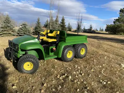 For sale is this DIESEL John Deere Gator 6X4. Features a power dump, differential lock, rubber box p...