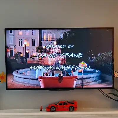 39.5” TV with wall mount and stand, View more