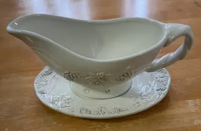 Roscher & Co. Vineyard Collection (ceramic). Soft white footed gravy boat with matching underplate....