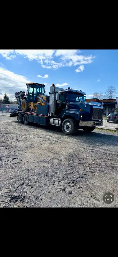 Camion plate forme internationale 2005 paystar pour transport de machineries lourds 640 000 km, mote...