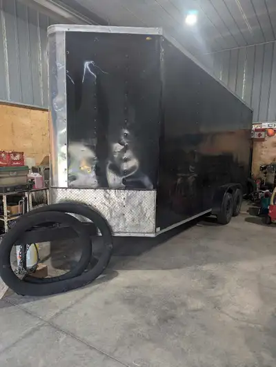 This tandem axle V-nose cargo trailer is ready for hauling! 2019 ramp door 22 ft from hitch to bumpe...