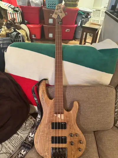 Get ready to groove with this used LTD bass guitar paired with an Orange Crush Bass 50 amp, perfect...
