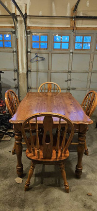 Used solid wood dining table and 4 chairs.