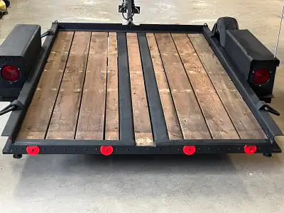 Like new. New paint, lumber, tires, rims, wheel bearing, lights, hitch 50 inches wide, 6.5 feet long