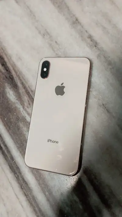 iPhone XS pink gold colour, unlocked. No charger or case...a friend gave it to me but I have no need...