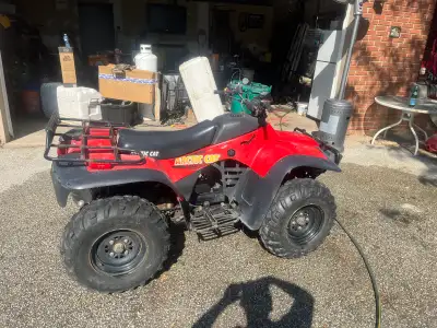 This 2001 Arctic Cat 300cc ATV is a reliable and capable machine perfect for your next outdoor adven...