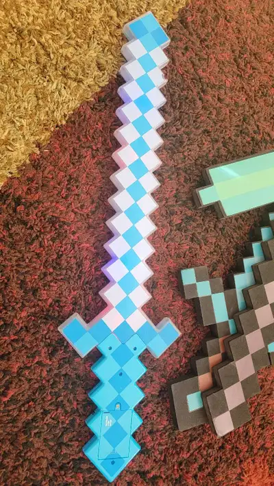 Your little Minecraft fan will love these used foam Minecraft sword and pickaxe! They've provided ho...