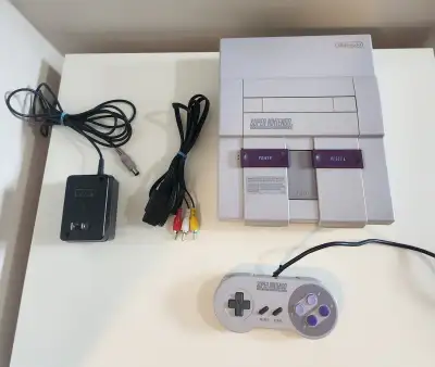 Pickup in Old St. Vital. Everything works. Includes: - 1 official Super Nintendo Controller - All ne...