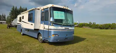 2003 Holiday Rambler. 330 Cummins, Allison auto, retarded, triple slide. Very nice interior with cha...