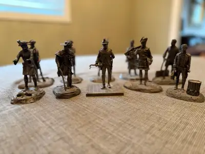 I'm selling a collection of Franklin Mint pewter soldiers, each posed in a unique stance with impres...