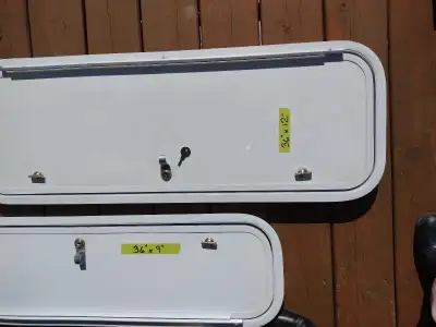 New RV exterior storage compartment doors with keys. Aluminum frames and fiberglass construction 36"...