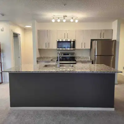 AVAILABLE IMMEDIATELY – MOVE-IN READY Bright Corner 2-Bed + Den | 2 Full Baths | Heated Underground...