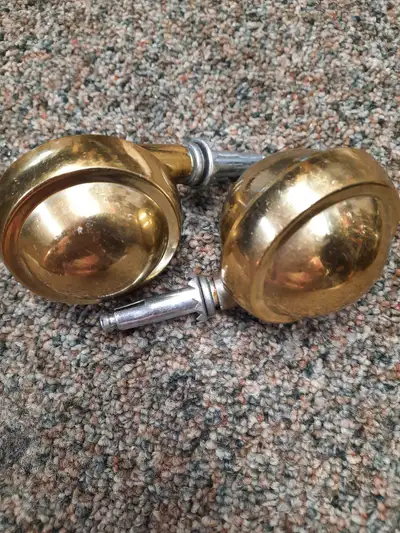 These are a set of used brass-finish caster wheels, perfect for adding a touch of vintage charm to y...