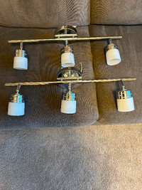 Two adjustable track lights, silver finish, 23 inches long.