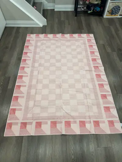 Add a pop of colour and modern geometric design to your space with this pink and white checkered IKE...
