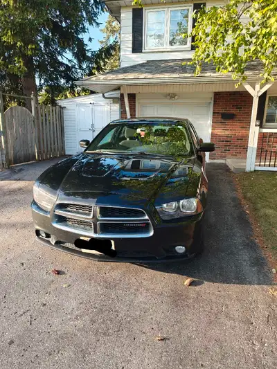 2013 dodge charger with 215,000km on it for sale. The car is fully certified. There's some rust on t...