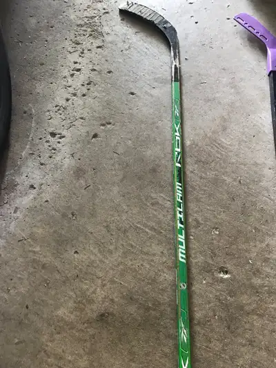This is a used Reebok Multilam RBK hockey stick, perfect for street hockey or practicing your shot....