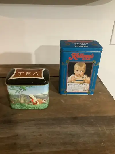 Vintage (50-60’s) Brooke Bond Tea Tin (Plantation Scene) & Vintage (1997) Kelloggs Tin. Both in exce...