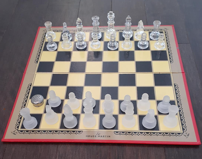 This is a lovely folding heavy cardboard draught or chess board made by House Martin in England. The...