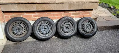 4 Firestone all season tires sized 185/65R14 on 4x100 steel wheels. The tires were mounted on a Hyun...