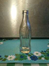 Vintage embossed 6 oz Coca Cola bottle excellent condition.