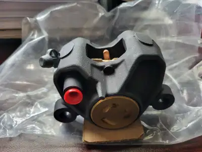 Brand New in Box Buell Rear Brake Caliper Complete with Brake Pads Part Number H0102.1AM $175