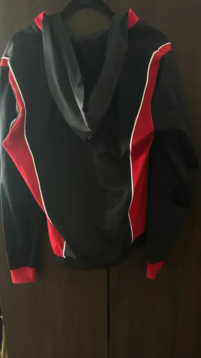 Red and black men’s outerwear, good as new, size medium from pet / smoke free home.