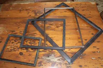 Hi. I have a box lot of 4 old wooden frames for sale. They would be great for various projects. The...