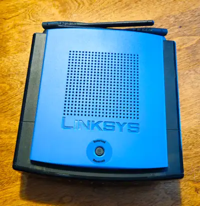 Linksys WRT150N is a legacy Wireless-N (Draft 802.11n) home router featuring 54 Mbps Wireless-G comp...