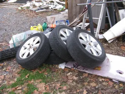 4- 17" Subaru rims. tires 2 are worn & 2 are fair. $200 /BO you pick up