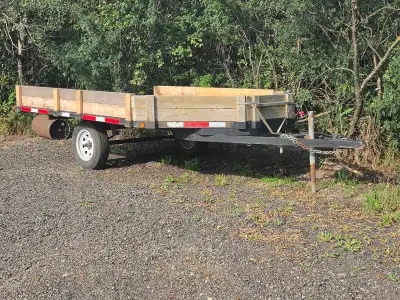 12 foot long deck 8 feet wide. Two 8 foot ramps slide out from under the deck great for sleds, lawn...