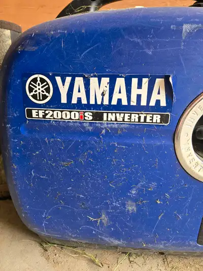 This is a used Yamaha EF2000iS inverter generator, perfect for camping or emergency power, with a ra...