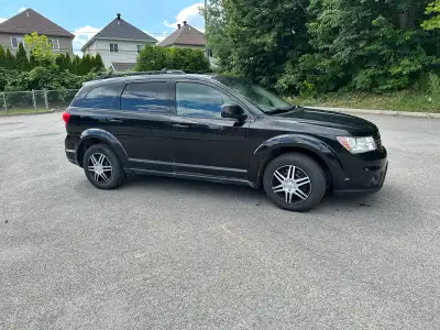Reliable Dodge Journey SXT is a black mid-size crossover SUV automatic . This vehicle has a roof rac...