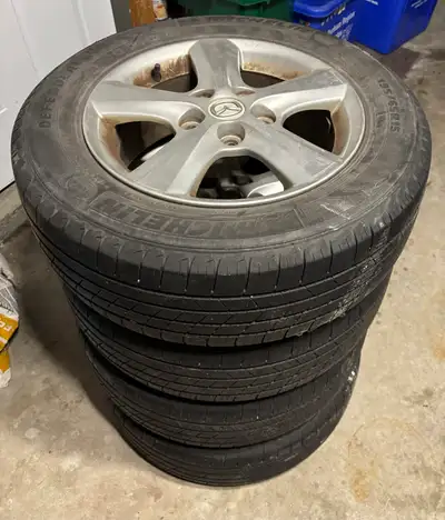 Four Mazda 3 Original Rims with tires Tire size 19565R15 - ties to be replaced Rims are in good cond...
