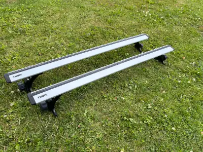 Thule cross bars and foot pack in great condition. Bars; 2 ea Thule Aeroblade 47” long. Load capacit...