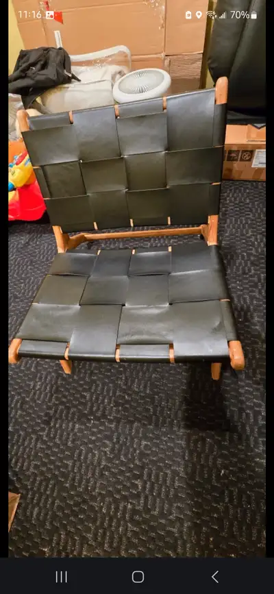 100% Black leather on Teak accent chair from steuctube. Has slight imperfection on leather seat.