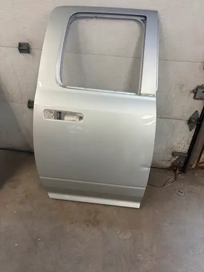 2010-2020 Dodge Ram Quad Cab Rear Passenger Door Used OEM Has repairable dent see picture. Silver pa...