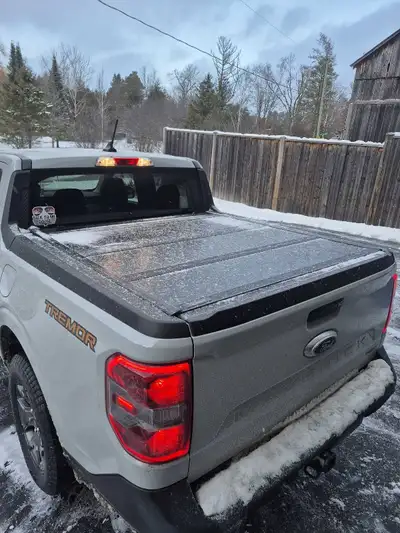 This trifold tonneau cover fits all Ford Mavericks. This cover is in excellent used condition and co...