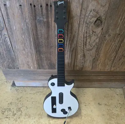 Wii. Uses wiimote not dongle Unleash your inner rockstar with this pre-loved Gibson Guitar Hero cont...