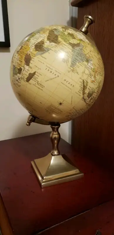 World Globe on brass base, 15" tall. New