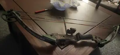 This is a Bear Odyssey II 85lb compound bow, perfect for archery enthusiasts. It's a used bow but in...
