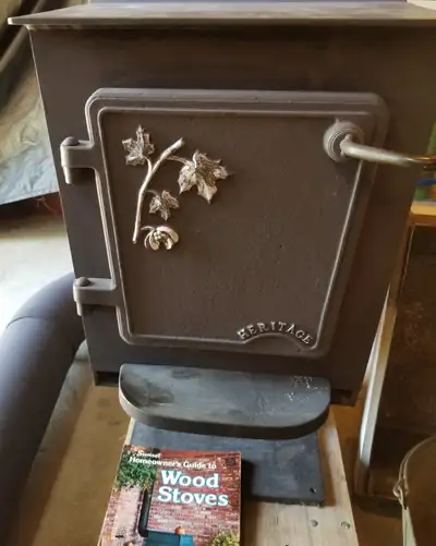 Beautiful HERITAGE, wood burning stove complete with rear mount blower fan. 1/ 55 HP, and electric c...